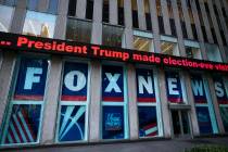 FILE - A headline about President Donald Trump is displayed outside Fox News studios in New Yor ...