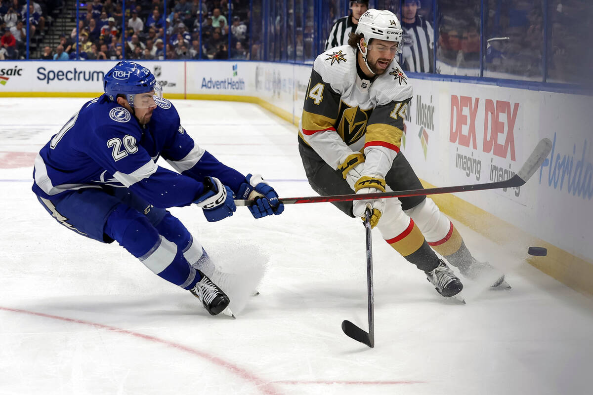 Tampa Bay Lightning's Nicholas Paul (20) defends against Vegas Golden Knights' Nicolas Hague du ...