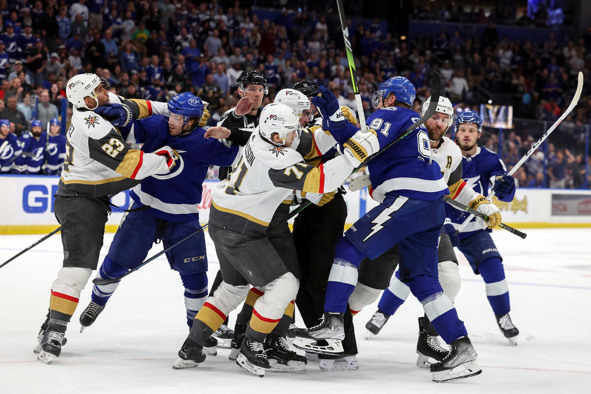 Members of the Vegas Golden Knights and Tampa Bay Lightning tangle at the end of the second per ...