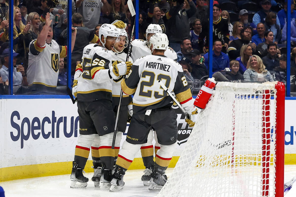Vegas Golden Knights' Keegan Kolesar (55) is congratulated on his goal against the Tampa Bay Li ...