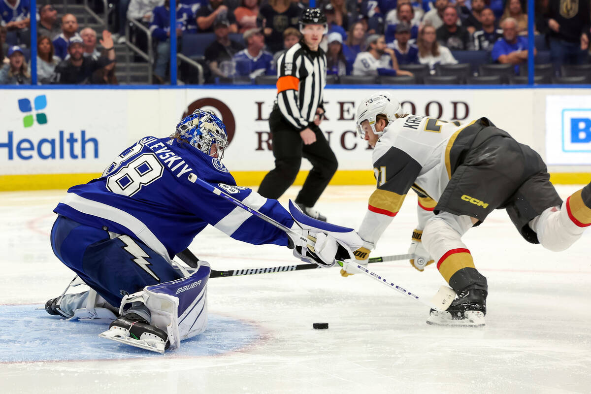 Vegas Golden Knights' William Karlsson, right, scores past Tampa Bay Lightning goaltender Andre ...