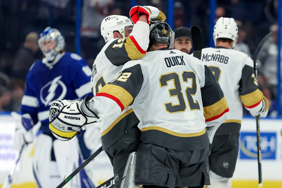 Vegas Golden Knights' Reilly Smith, front left, congratulates goaltender Jonathan Quick (32) on ...