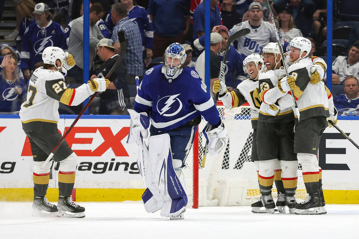 Tampa Bay Lightning goaltender Andrei Vasilevskiy, center, skates off as Vegas Golden Knights c ...