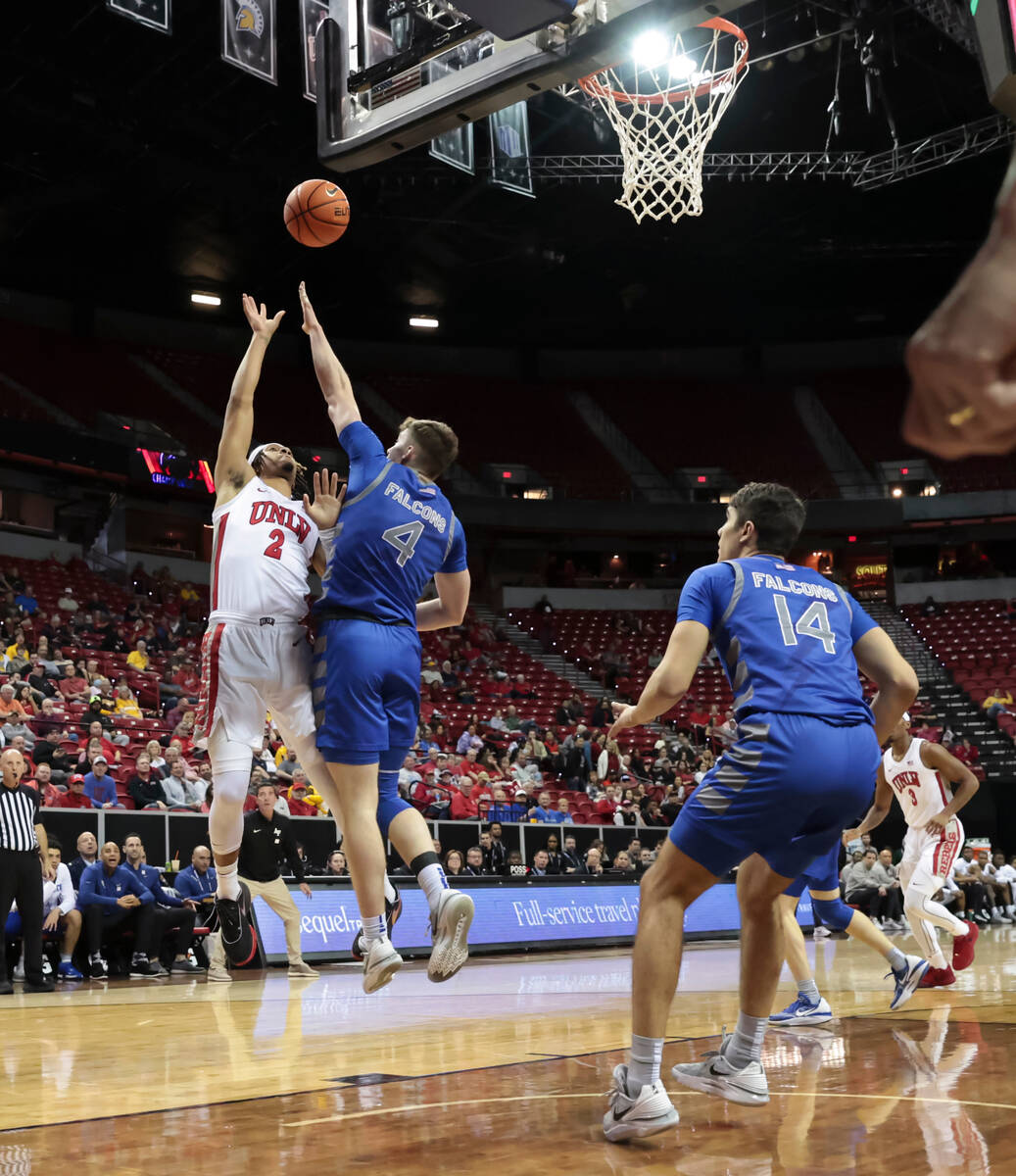 UNLV guard Justin Webster (2) shoots over Air Force guard Carter Murphy (4) during the first ha ...