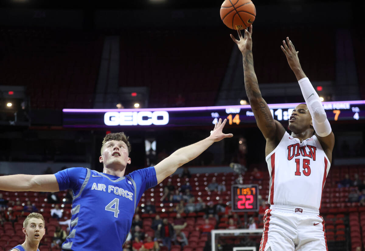 UNLV guard Luis Rodriguez (15) shoots over Air Force guard Carter Murphy (4) during the first h ...