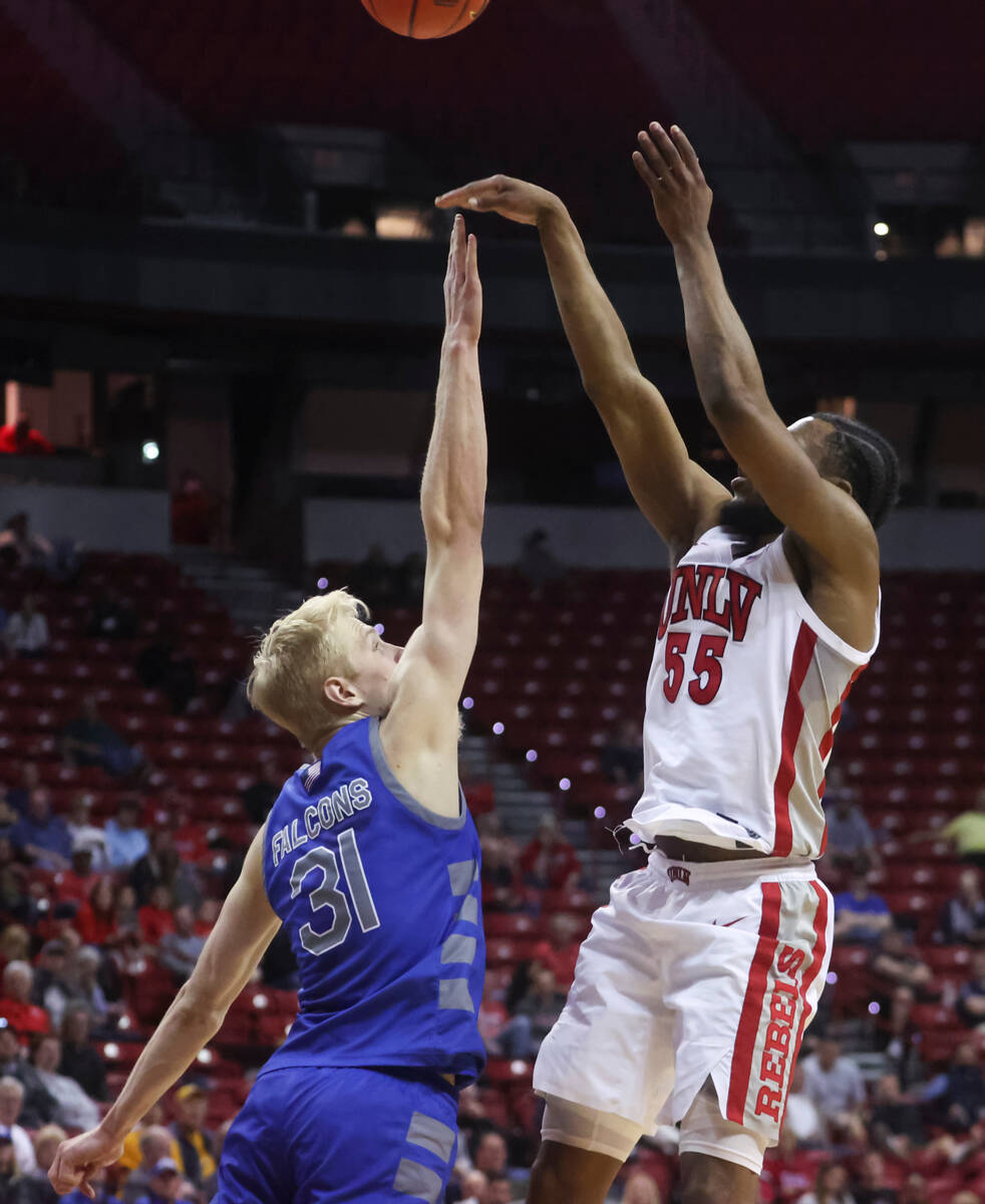 UNLV guard EJ Harkless (55) shoots over Air Force forward Rytis Petraitis (31) during the secon ...