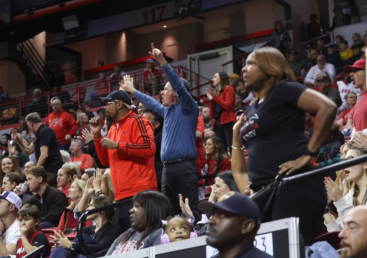 UNLV fans react as the team leads against Air Force during overtime in a basketball game in the ...