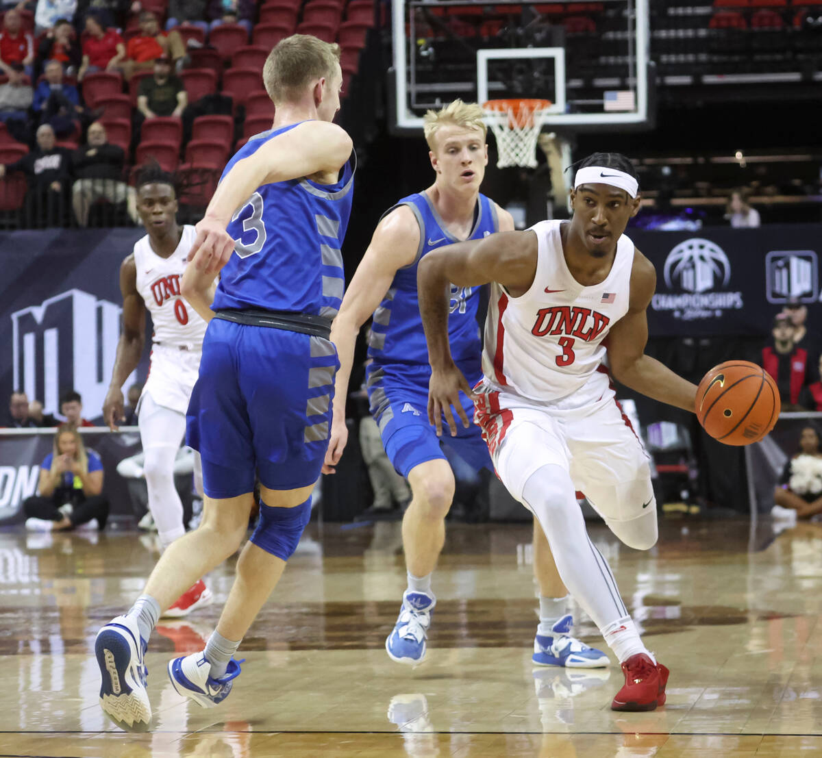 UNLV guard Shane Nowell (3) looks to pass the ball around Air Force guard Jake Heidbreder (3) d ...