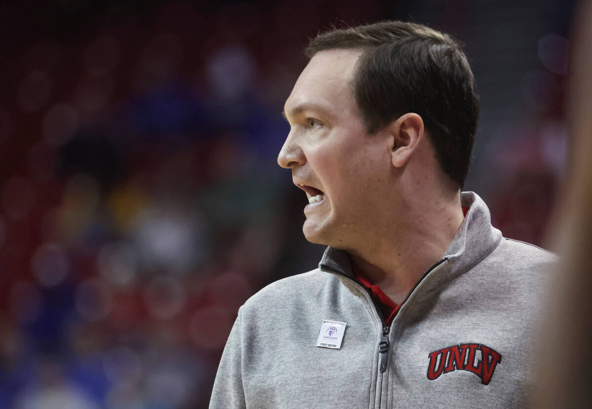 UNLV head coach Kevin Kruger shows to his team during the second half of a basketball game agai ...