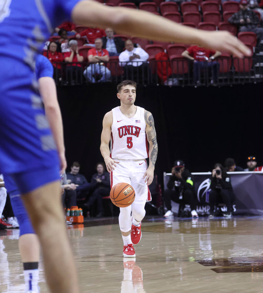 UNLV guard Jordan McCabe (5) brings the ball up court against Air Force during the first half o ...