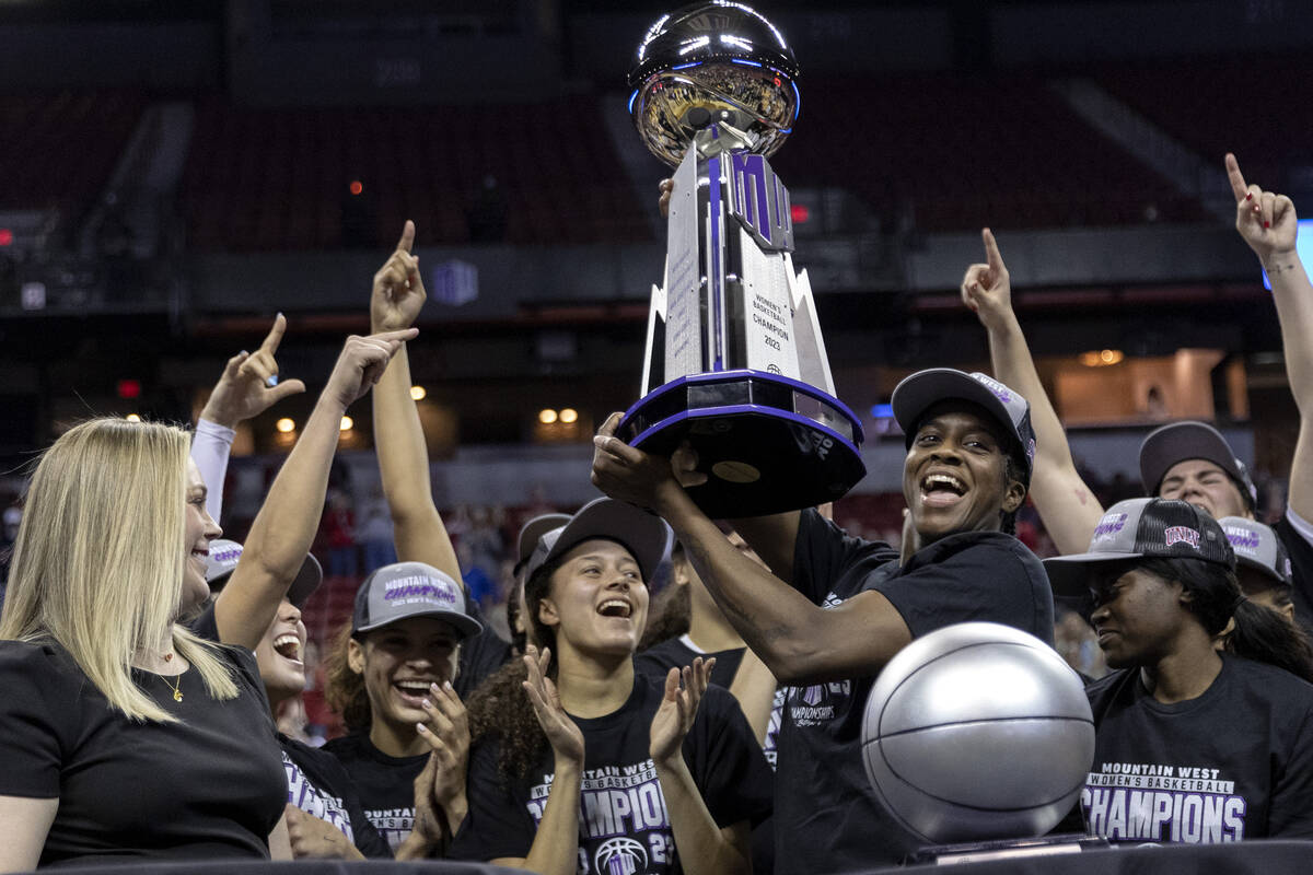UNLV Lady Rebels center Desi-Rae Young, who was named tournament MVP, holds up her team’ ...