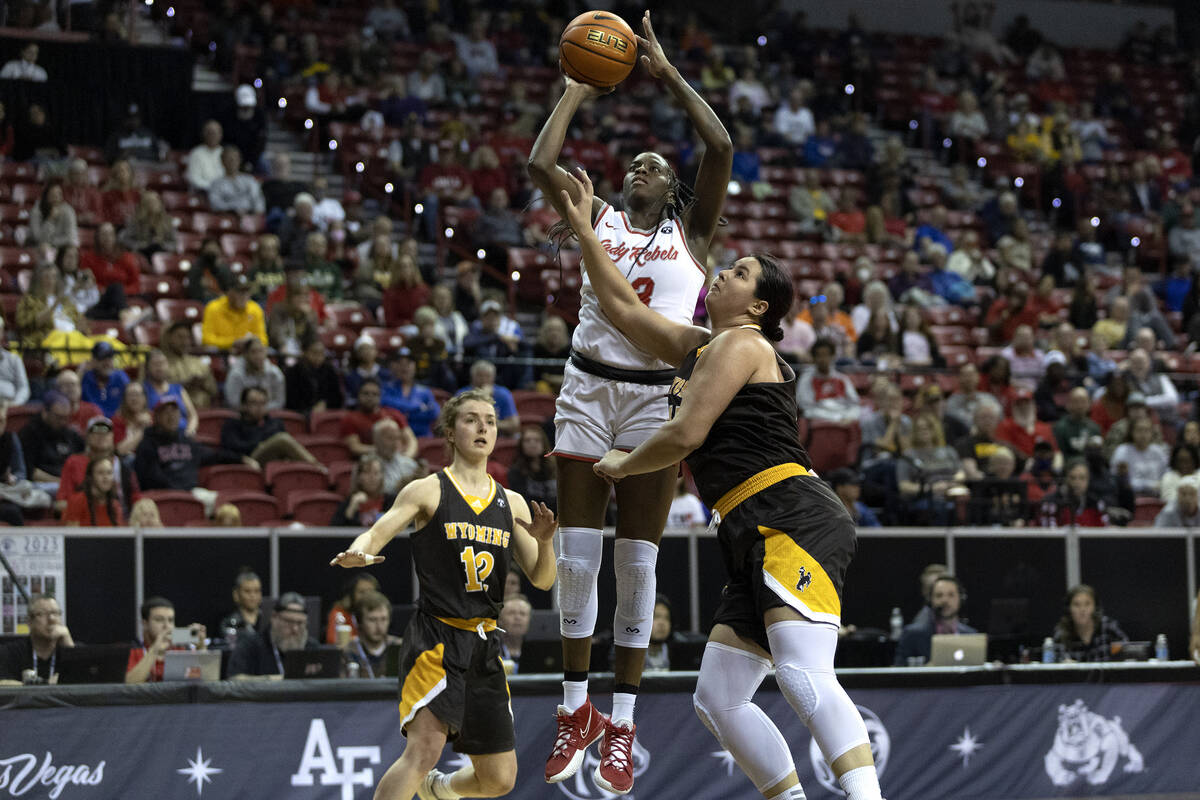 UNLV Lady Rebels center Desi-Rae Young (23) shoots against Wyoming Cowgirls  guard Malene Peders …
