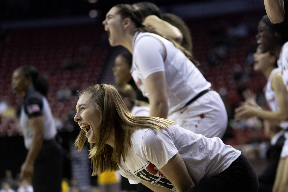 UNLV Lady Rebels guard Ashley Scoggin screams for her team after they scored during the second ...