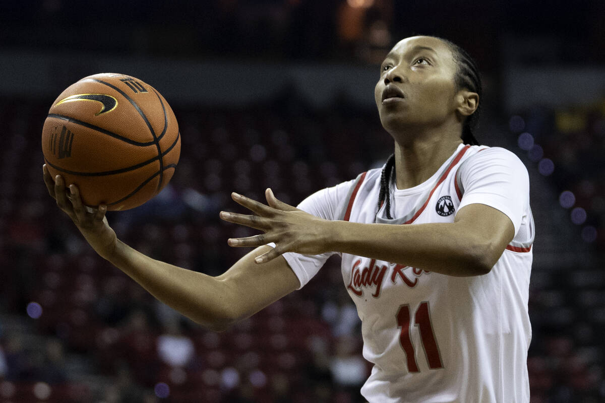 UNLV Lady Rebels guard Justice Ethridge (11) shoots against Wyoming Cowgirls during the first h ...