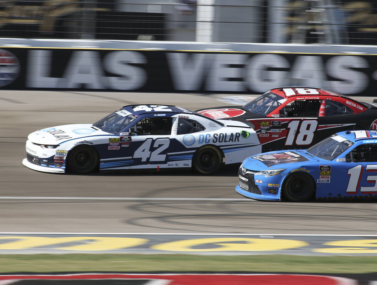 Ross Chastain (42) squeezes through Ryan Preece (18) and Stan Mullis (13) during the DC Solar 3 ...
