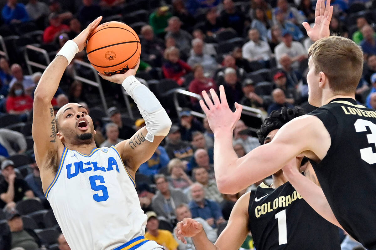 UCLA guard Amari Bailey shoots against Colorado during the second half of an NCAA college baske ...