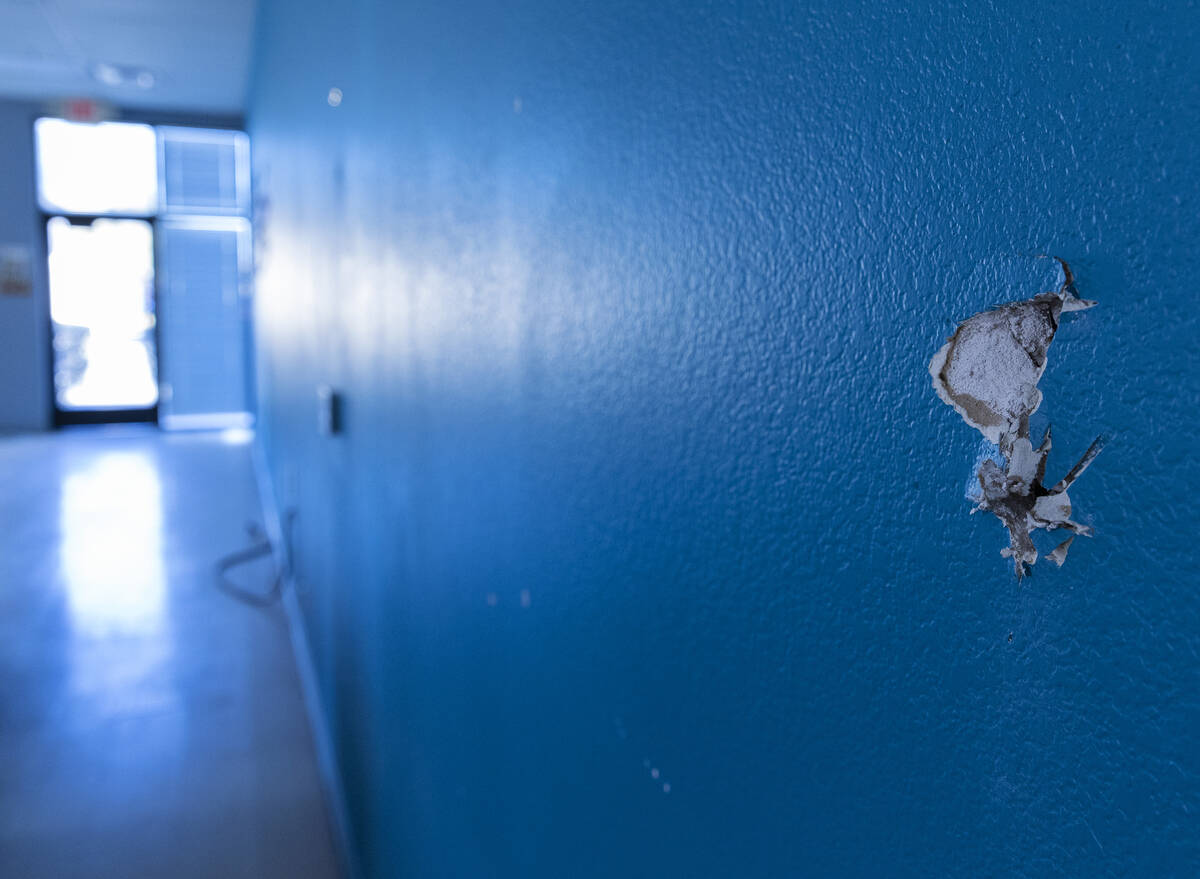 A damaged wall is seen at Leaders In Training (LIT) building on Tuesday, March 7, 2023, in Las ...