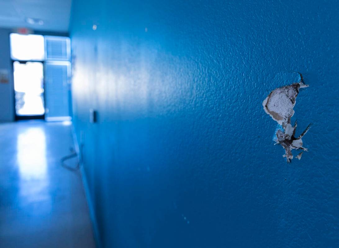 A damaged wall is seen at Leaders In Training (LIT) building on Tuesday, March 7, 2023, in Las ...
