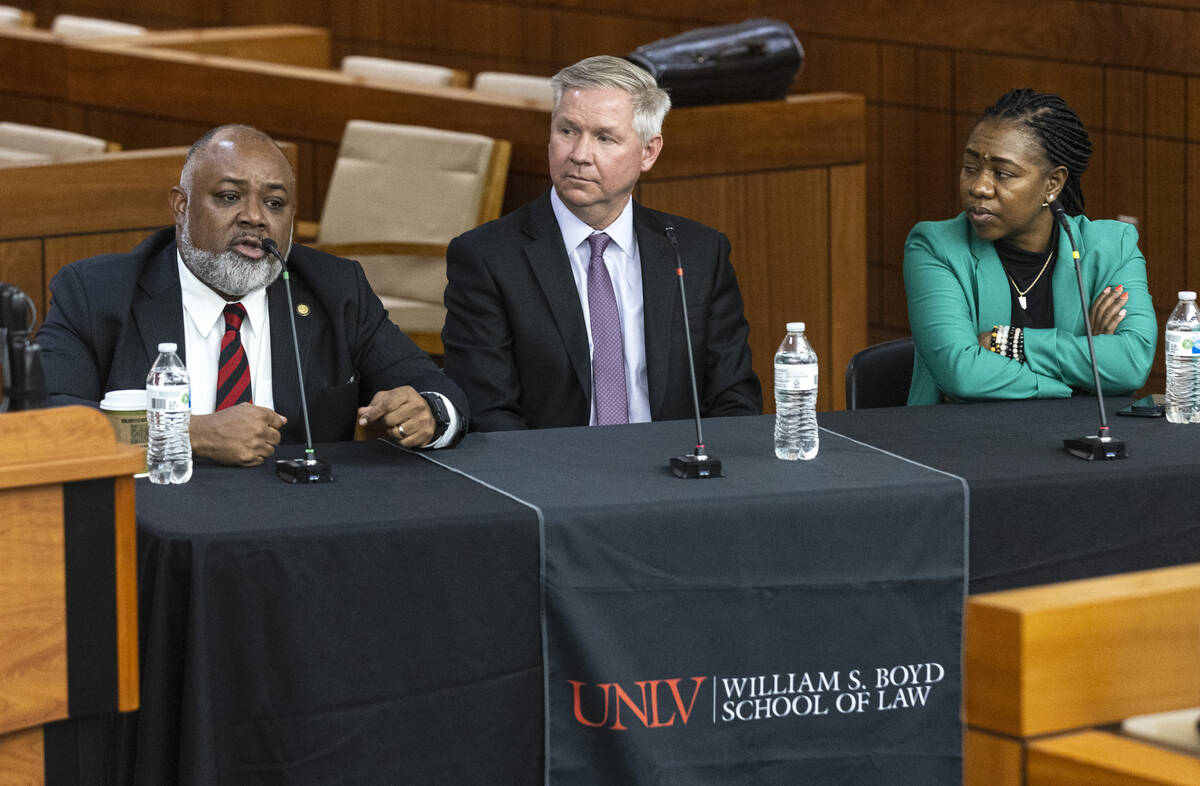 Jason Frierson, left, United States attorney for the District of Nevada, speaks as Darin Imlay, ...