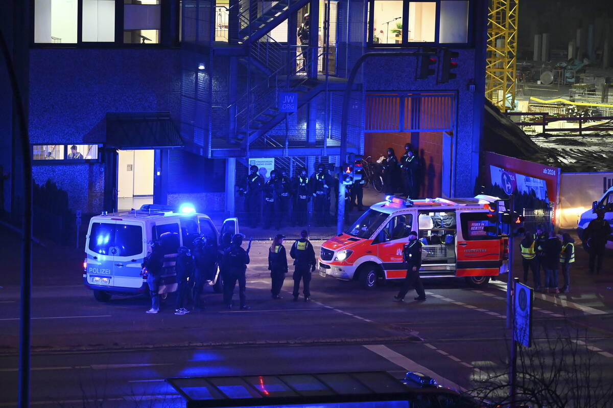 Armed police officers near the scene of a shooting in Hamburg, Germany on Thursday March 9, 202 ...