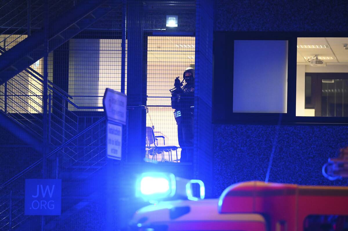 Armed police officers near the scene of a shooting in Hamburg, Germany on Thursday March 9, 202 ...