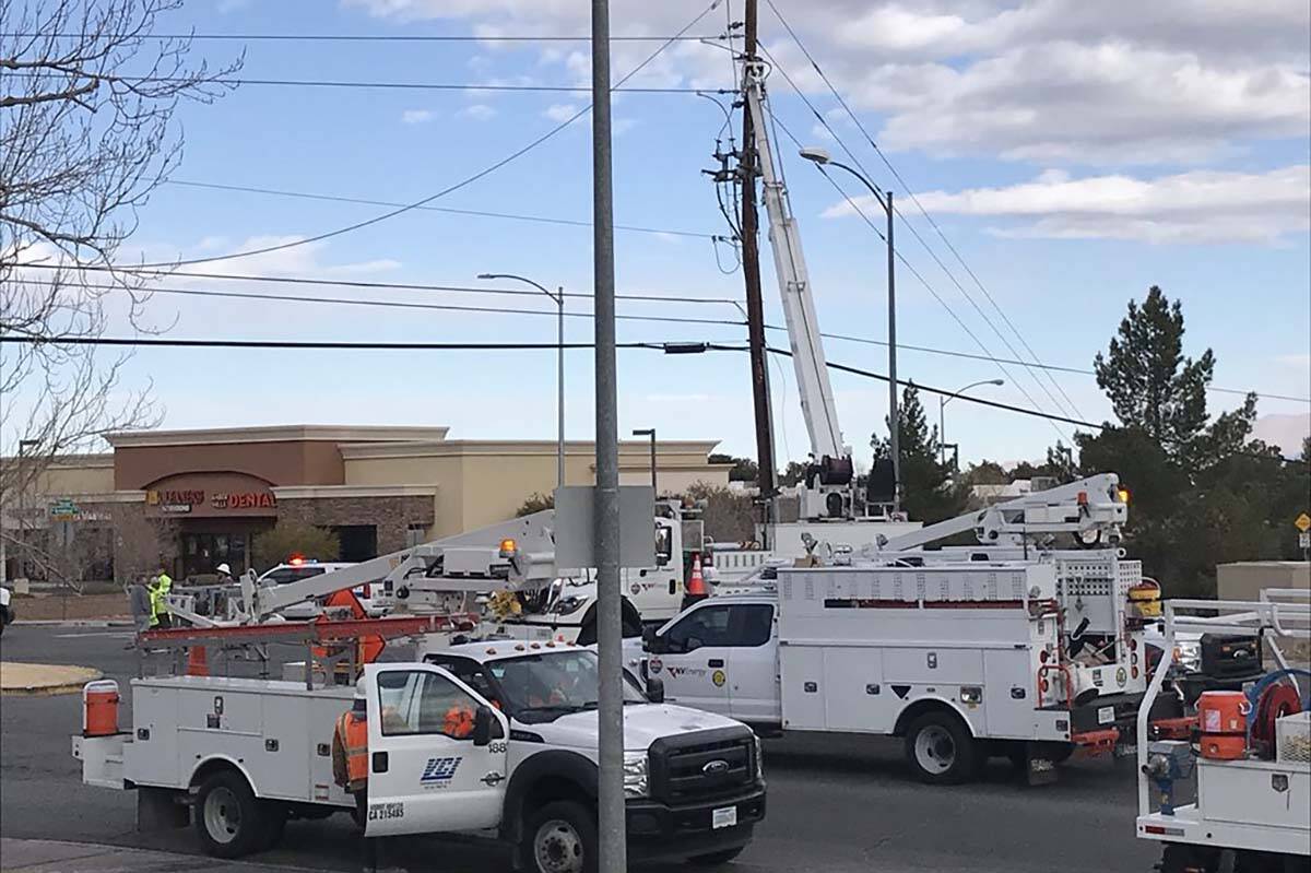 NV Energy crews work to repair power lines and poles that came down in February 2018 at Horizon ...