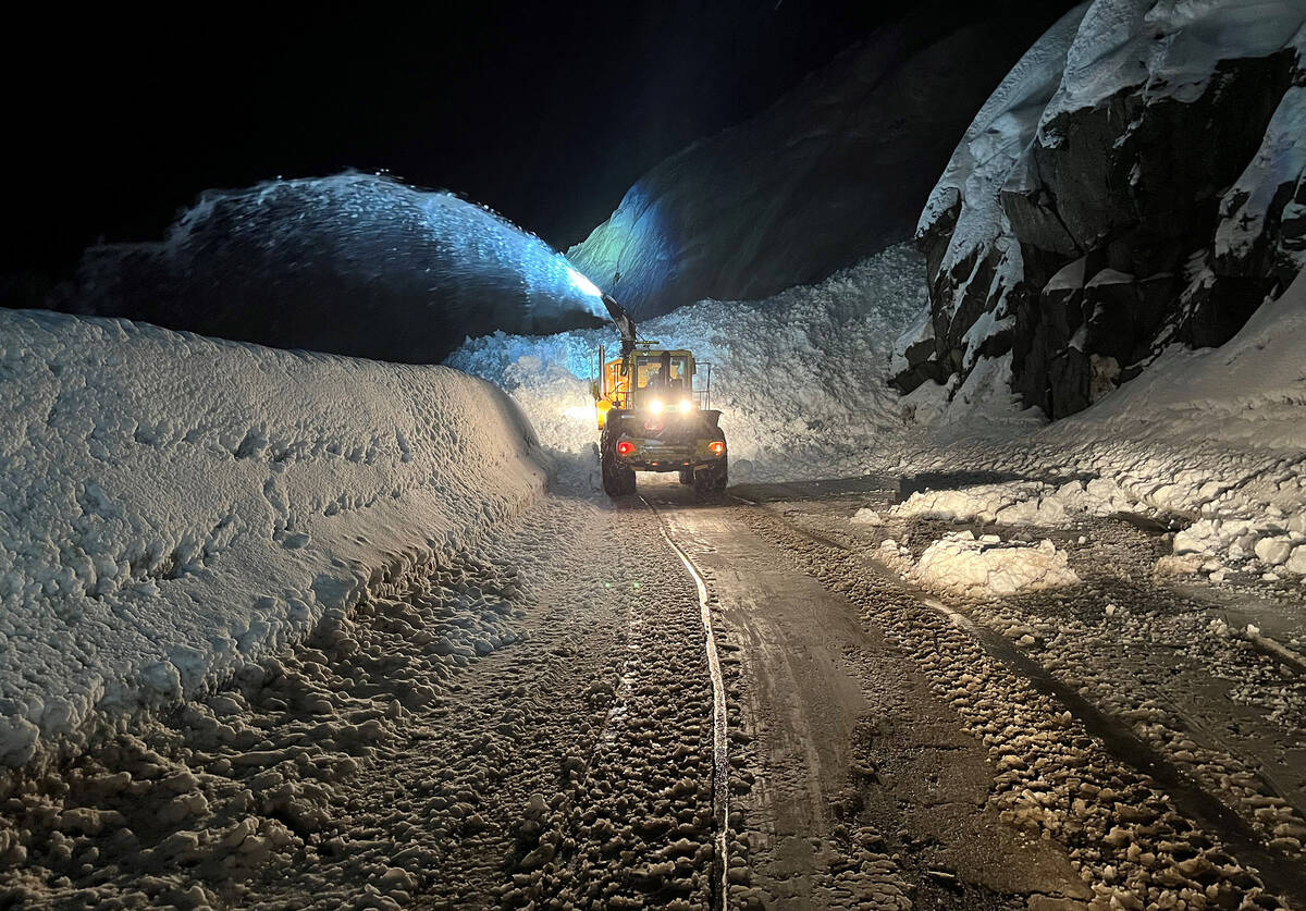 A massive amount of snow fell onto California Route 50 overnight during an avalanche control op ...