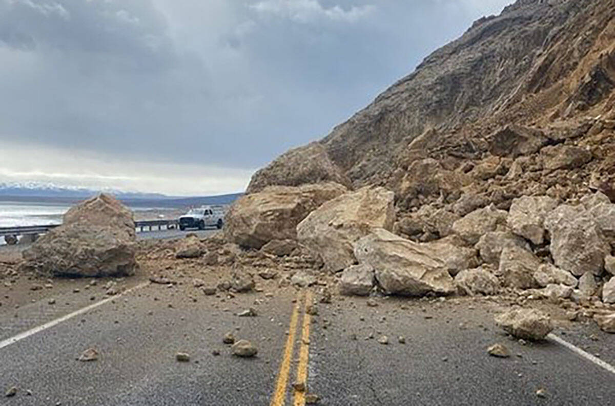 Rock covers US 95 near Walker Lake between Schurz and Hawthorne, Nev., on Friday, March 10, 202 ...