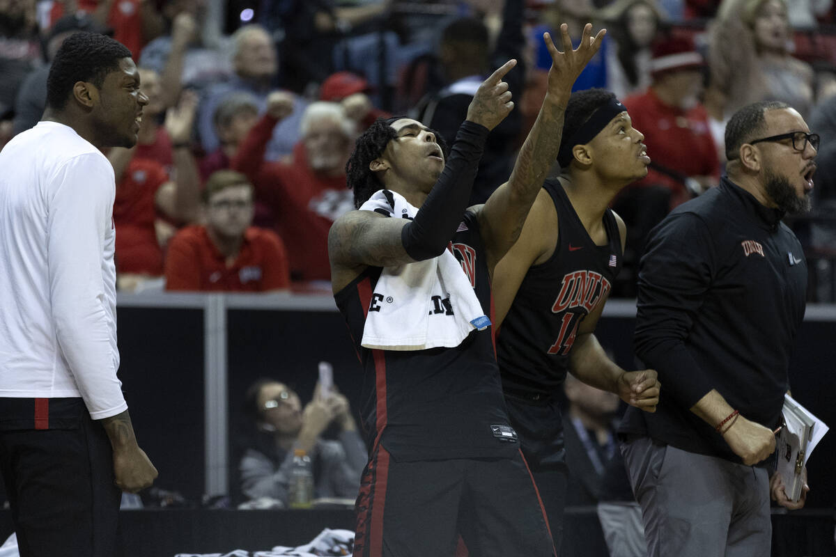 UNLV Rebels guard Keshon Gilbert, center, cheers after his team scored during the second half o ...