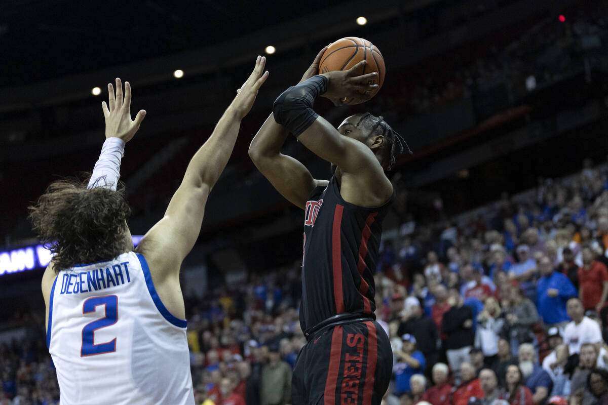 UNLV Rebels guard Shane Nowell (3) shoots a three-pointer against Boise State Broncos forward T ...