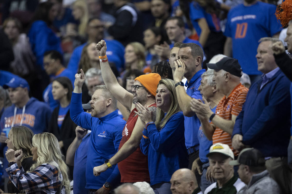Boise State Broncos fans cheer for their team after they beat the UNLV Rebels in overtime in an ...