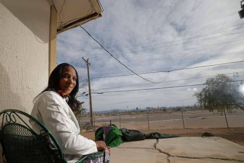 Nancy Johnson poses for a photo in her backyard where the Las Vegas Strip is seen Wednesday, Ma ...
