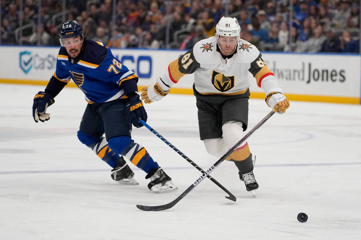 St. Louis Blues' Justin Faulk (72) and Vegas Golden Knights' Jonathan Marchessault (81) chase a ...