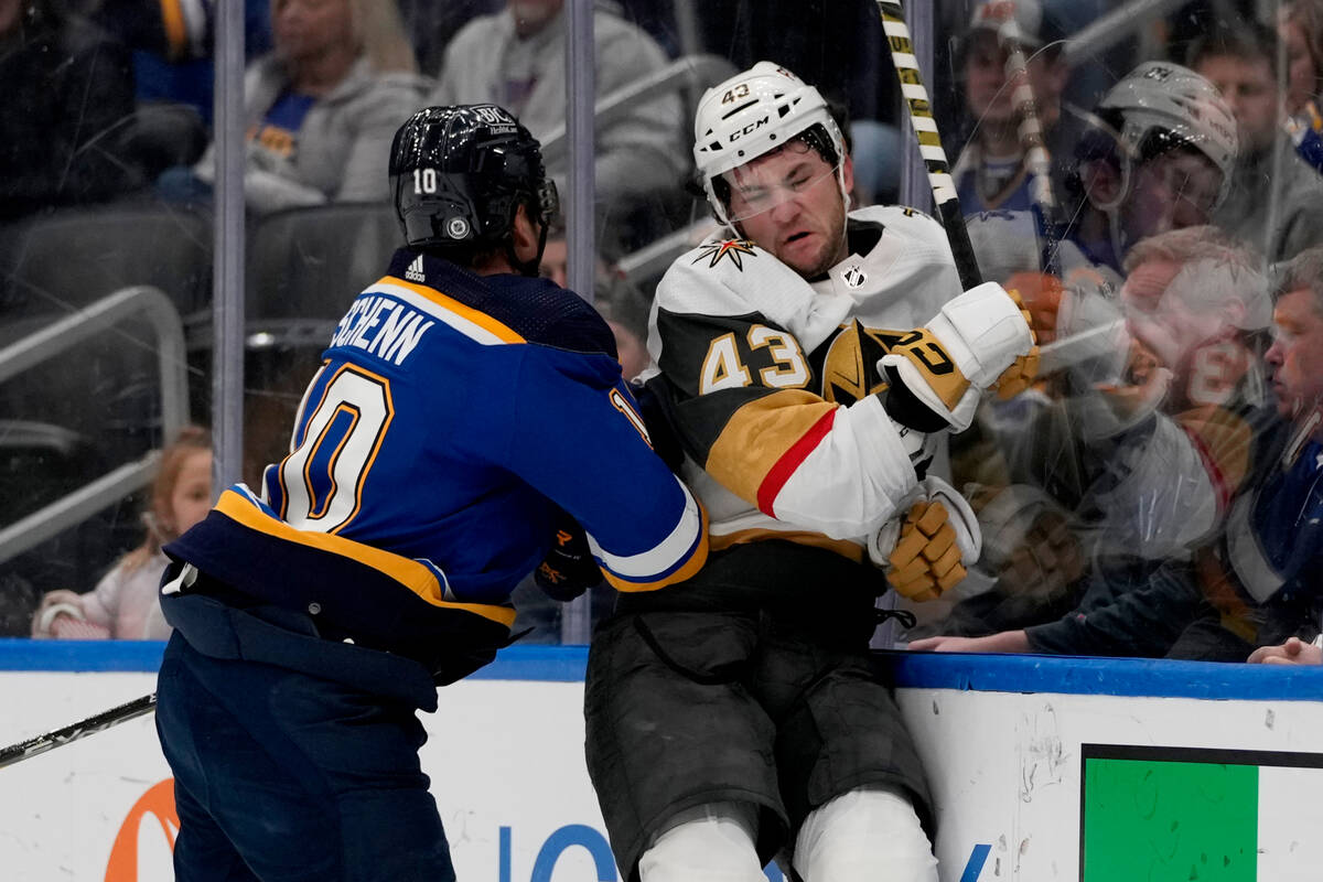 St. Louis Blues' Justin Faulk (72) checks Vegas Golden Knights