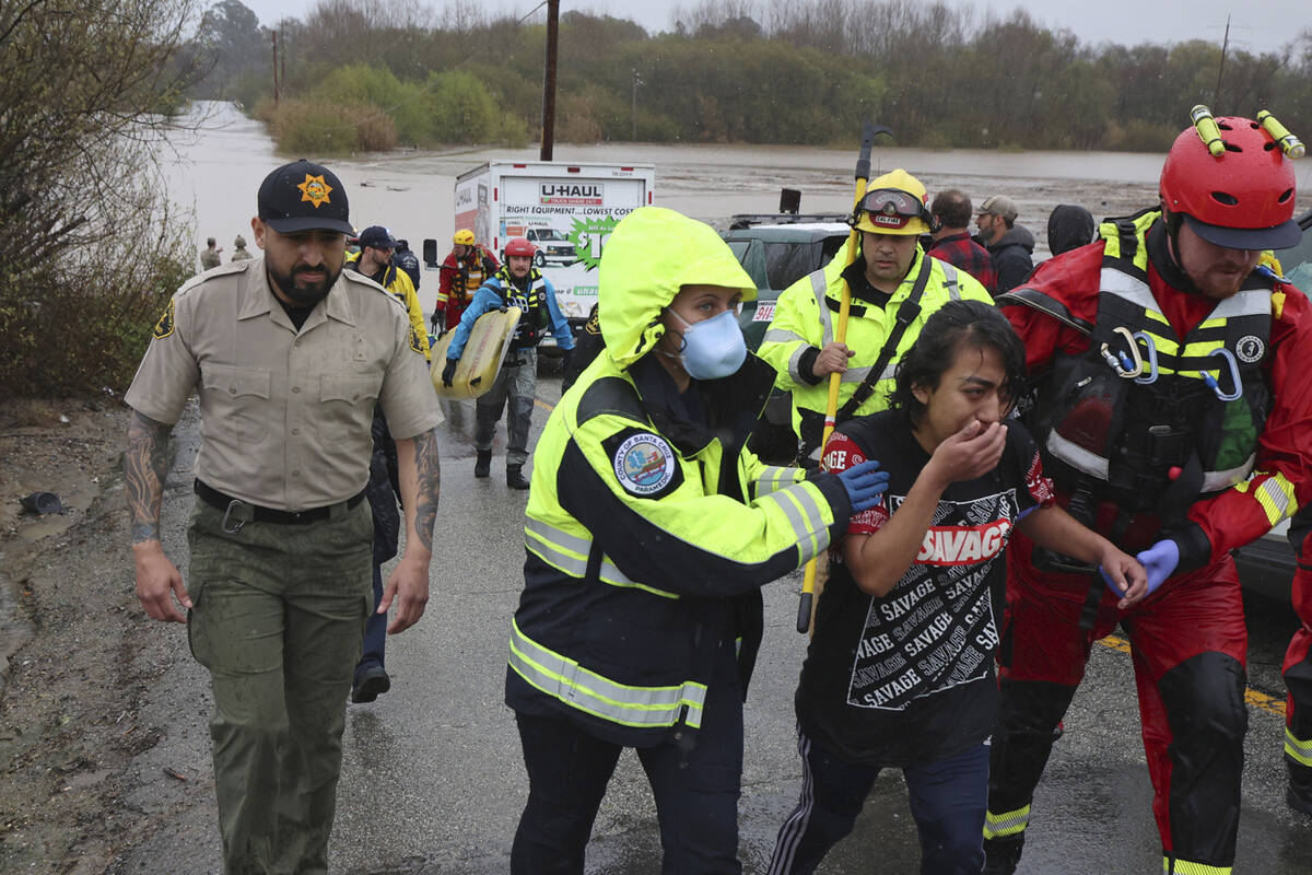 Lizbeth Hernandez is rescued from Casserly Creek after flood waters carried her truck off of Pa ...