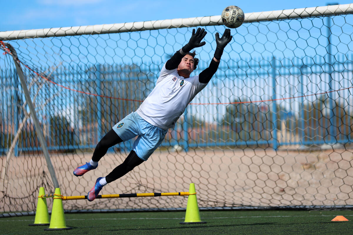 Goalkeeper Andre Zuluaga deflects the ball during a Las Vegas Lights FC soccer practice at the ...