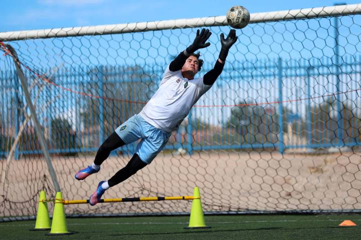 Goalkeeper Andre Zuluaga deflects the ball during a Las Vegas Lights FC soccer practice at the ...