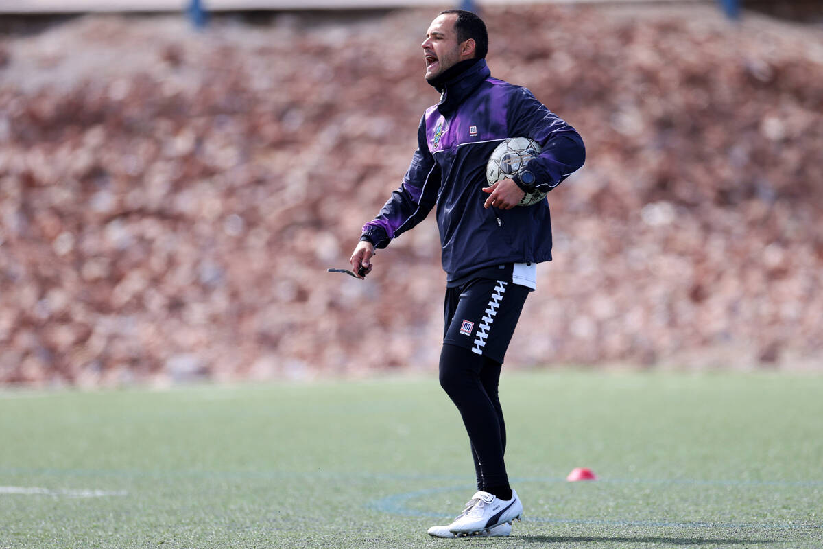 Coach Isidro Sanchez talks to his players during a Las Vegas Lights FC soccer practice at the K ...