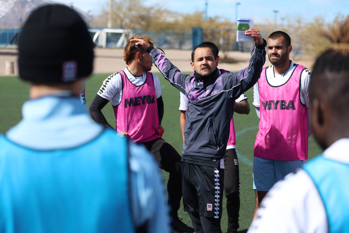 Coach Isidro Sanchez, center, talks to his players during a Las Vegas Lights FC soccer practice ...