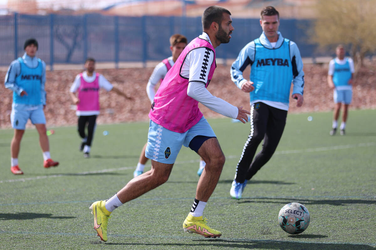 Pato Faz, left, looks for an open pass during a Las Vegas Lights FC soccer practice at the Kell ...