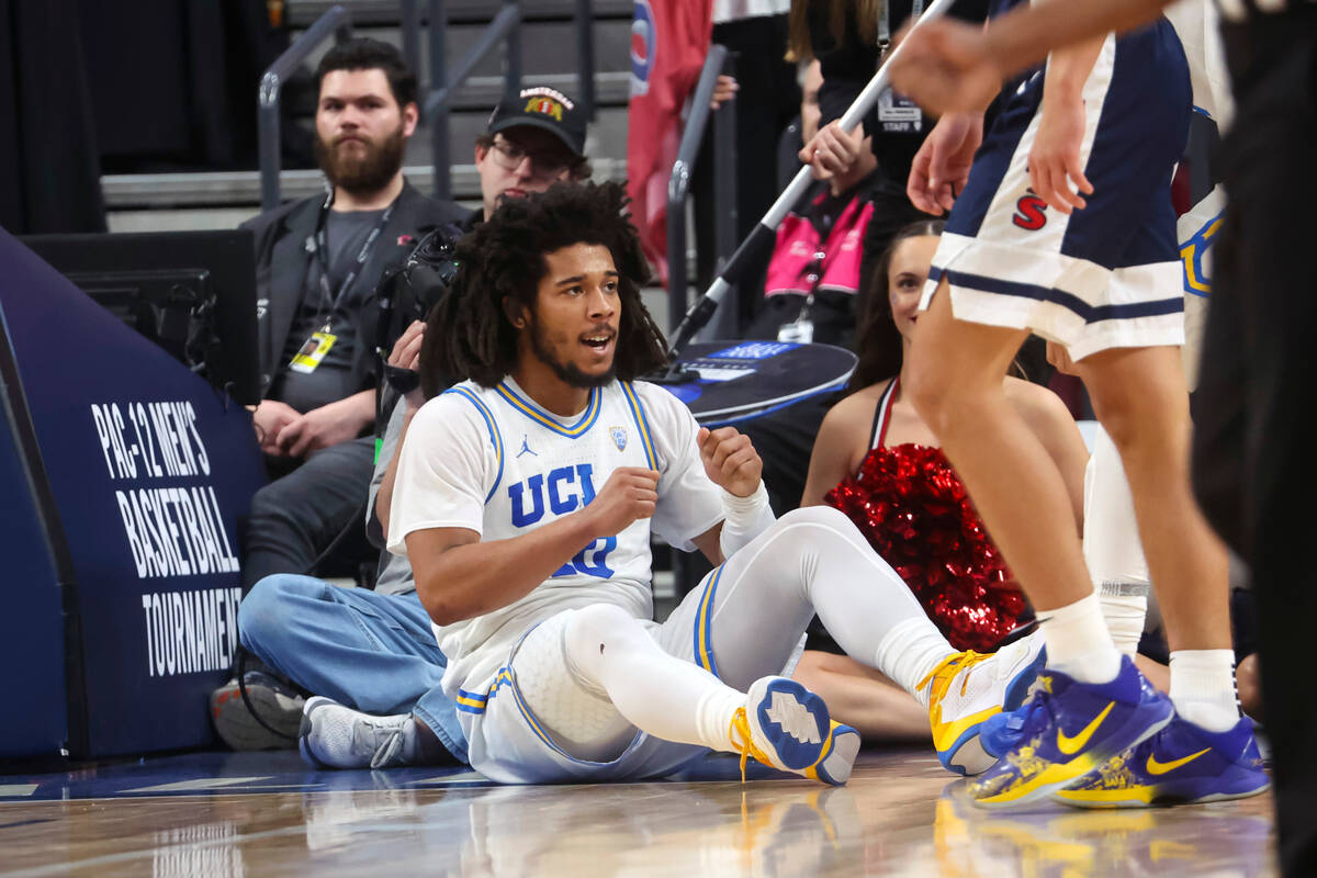UCLA guard Tyger Campbell (10) reacts after drawing a foul on a shot against Arizona during the ...