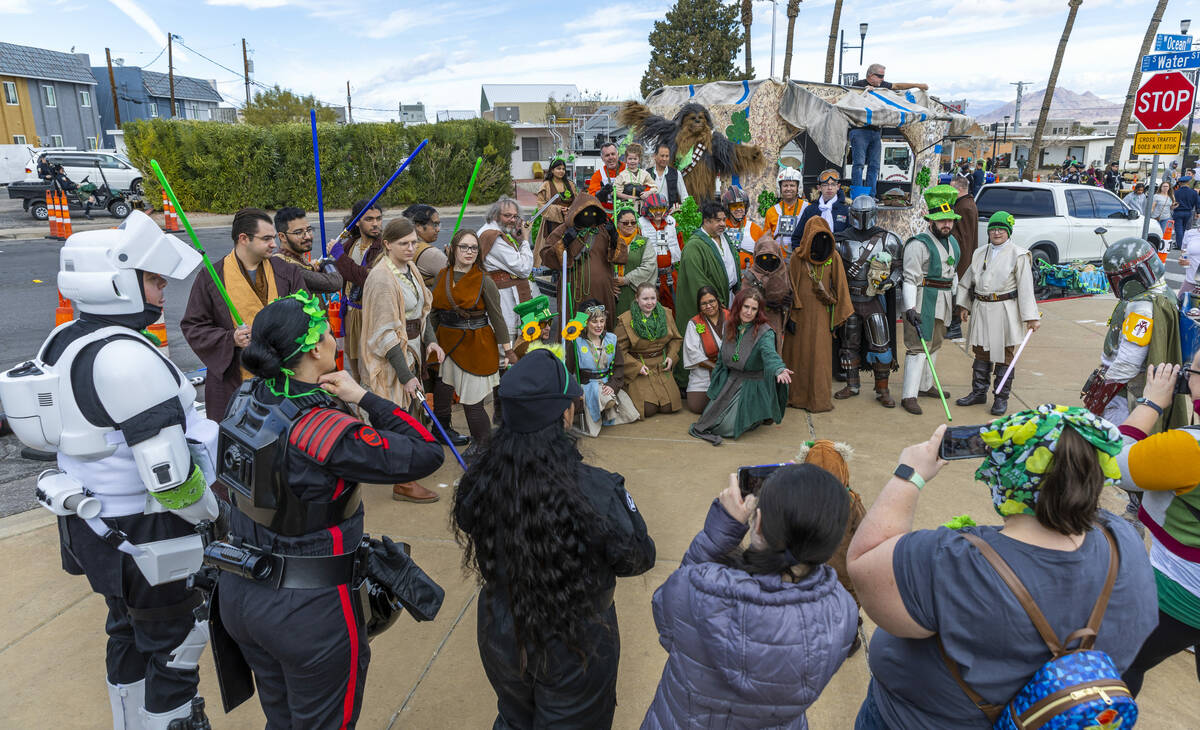 Star Wars characters gather for a photo in the start area for the parade down Water Street duri ...