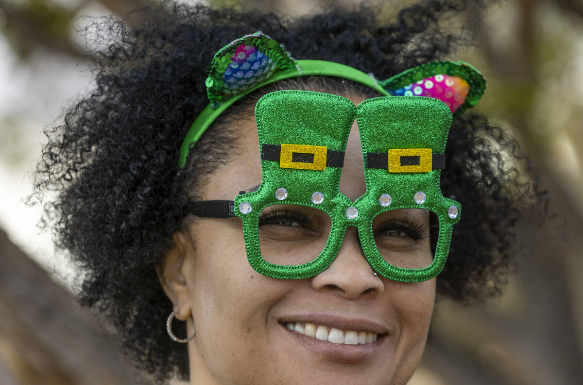 Petrone Hawkins of Henderson gets in the spirit for the parade down Water Street during the St. ...