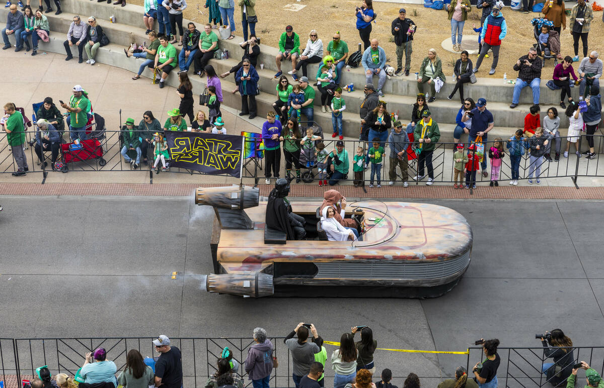 Star Wars characters pilot their craft along the parade route down Water Street during the St. ...