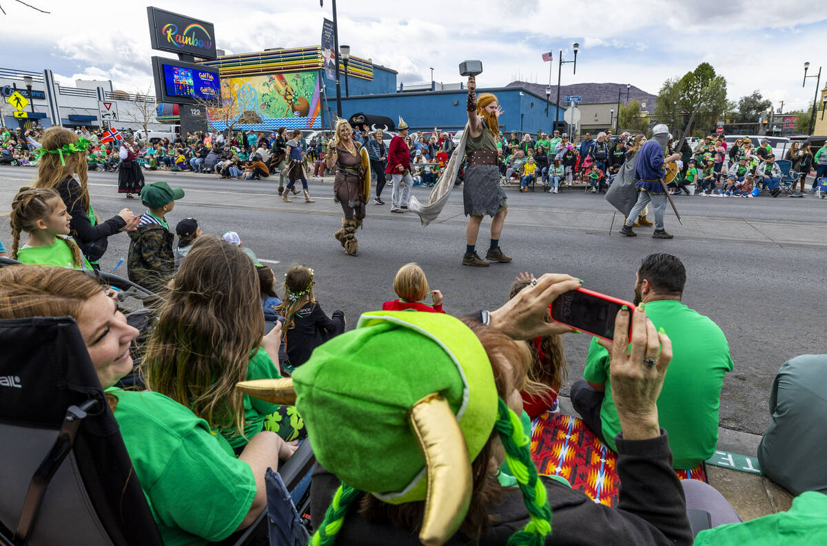 Vikings entertain the crowd along the parade route down Water Street during the St. Patrick ...