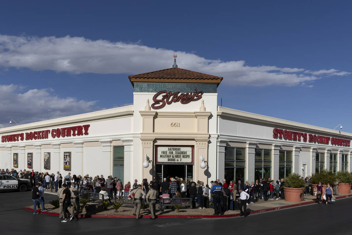 The line spans either side of the building before Florida Gov. Ron DeSantis speaks during a boo ...