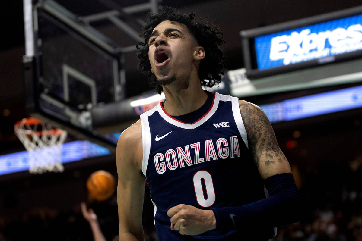 Gonzaga Bulldogs guard Julian Strawther (0) celebrates after referees called a foul on the St. ...