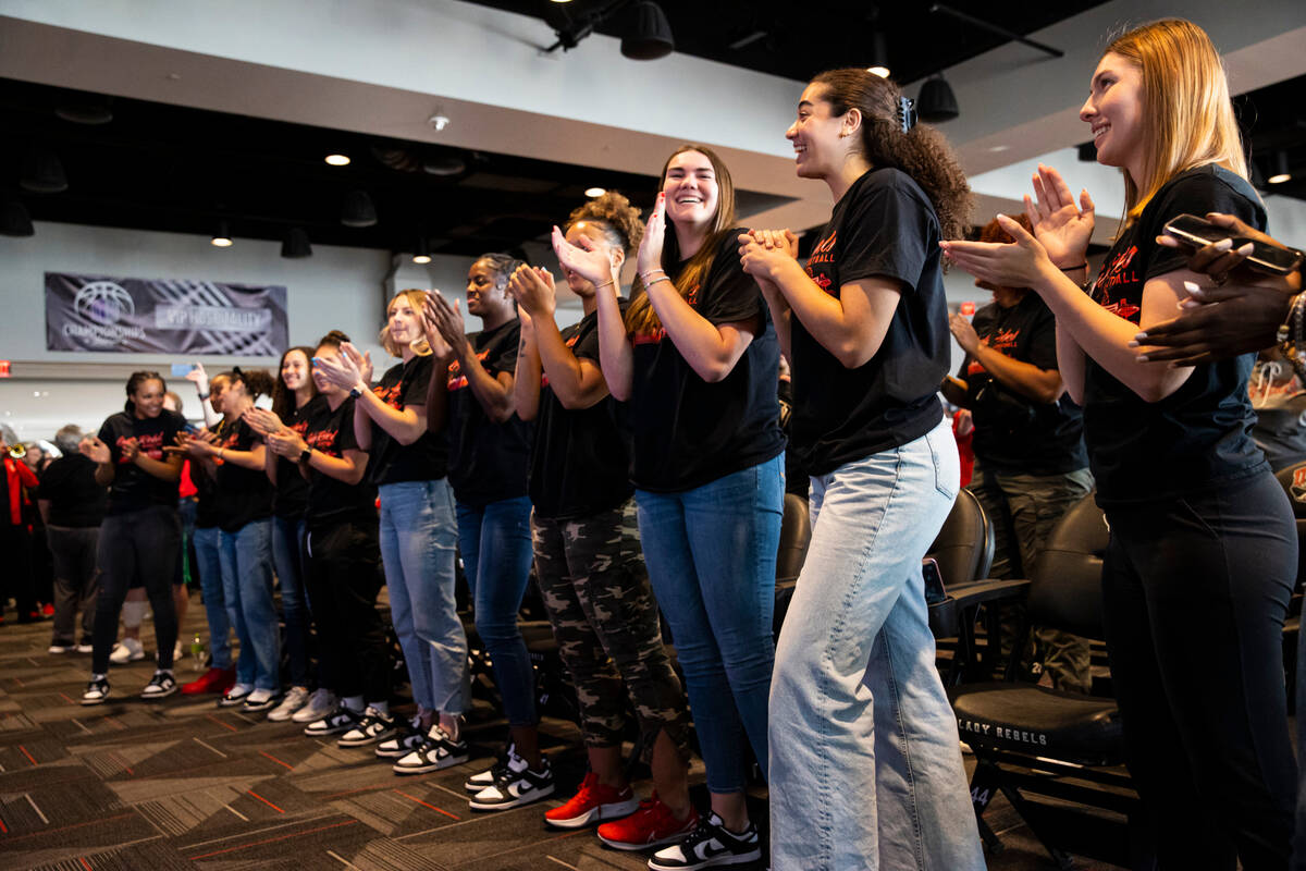UNLV Lady Rebels players celebrate after the tournament seeding and opponent was revealed on th ...