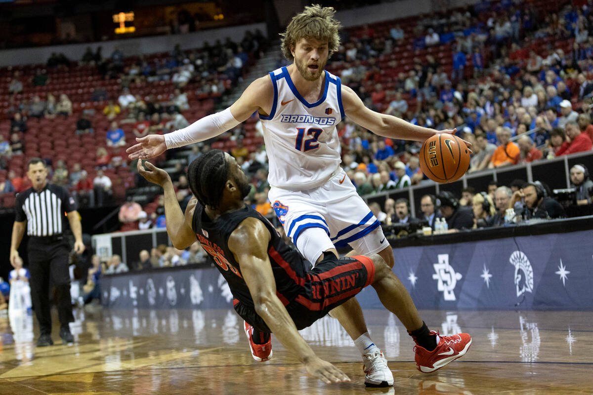 Boise State Broncos guard Max Rice (12) commits what referees deemed an offensive foul against ...