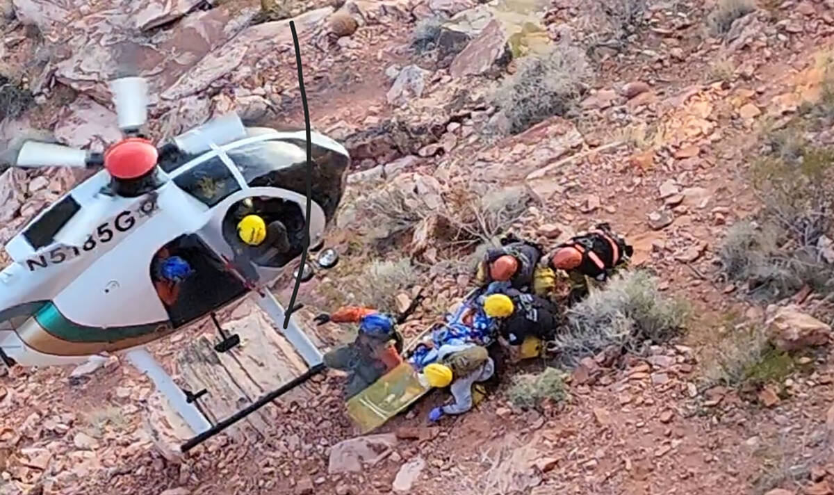 A Metro helicopter moves in to airlift a rappelling fall victim at Calico Basin at Red Rock Nat ...